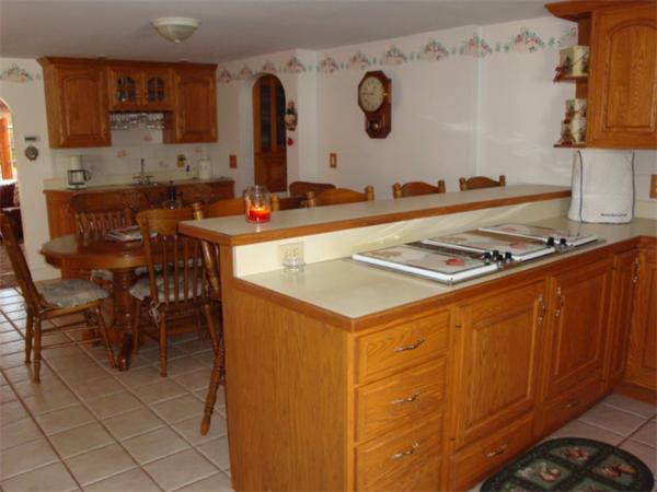 32 Middle Road Amesbury, MA 01913 - Photo 10 of 24 a kitchen with stainless steel appliances granite countertop a stove and a refrigerator