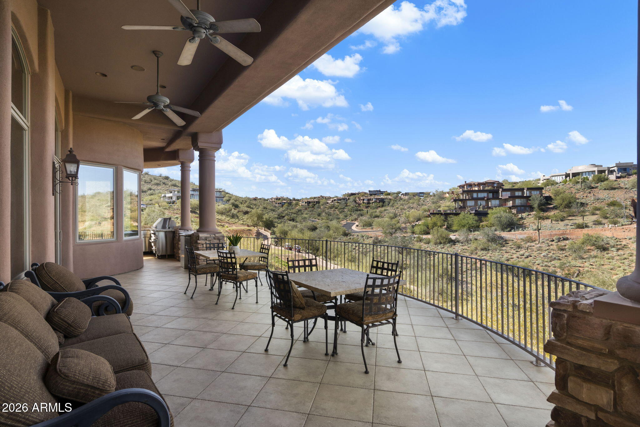 9624 Copper Ridge Trail Fountain Hills, AZ 85268 - Photo 31 of 57 a living room with couches a dinning table and chairs with a barbeque grill