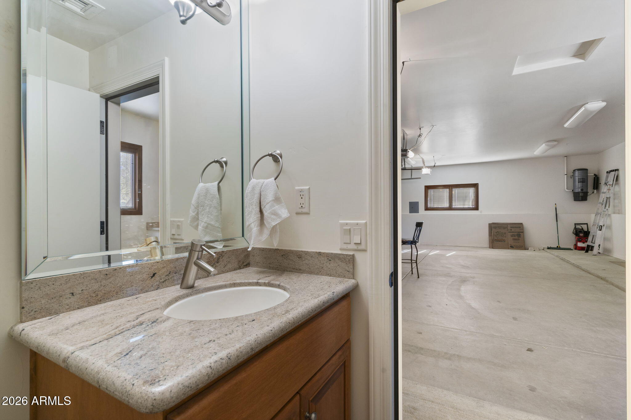 9624 Copper Ridge Trail Fountain Hills, AZ 85268 - Photo 48 of 57 a bathroom with a granite countertop sink and a mirror