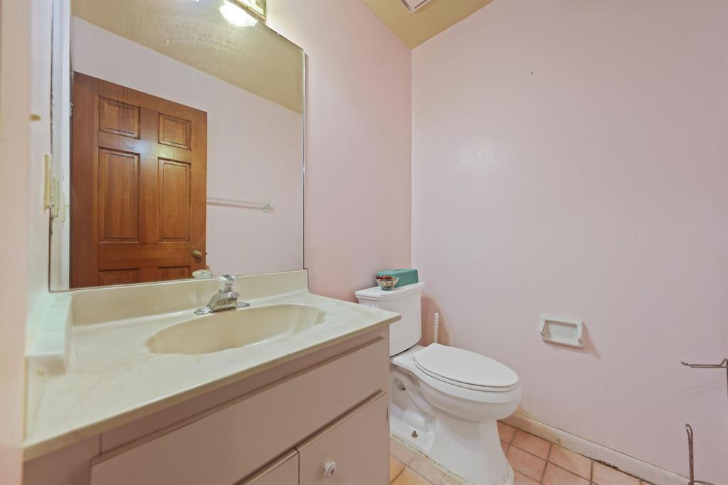 5172 Northwest 84th Road Coral Springs, FL 33067 - Photo 12 of 24 a bathroom with a sink a toilet and mirror