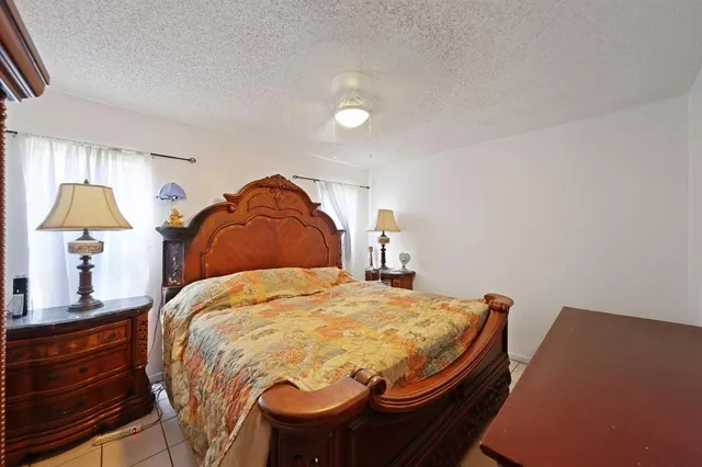 a bedroom with a bed and a closet