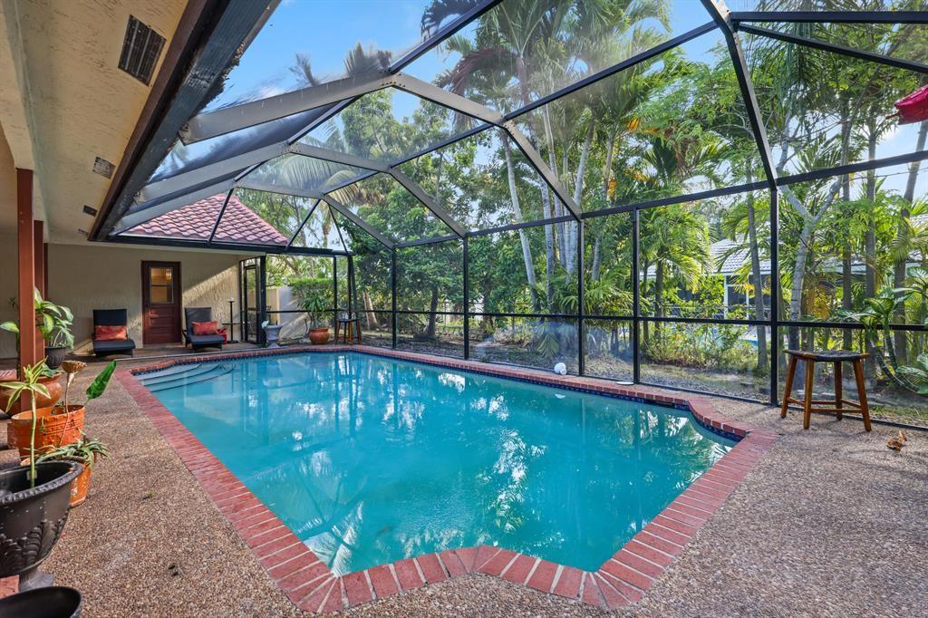 5172 Northwest 84th Road Coral Springs, FL 33067 - Photo 17 of 24 a view of swimming pool with a patio