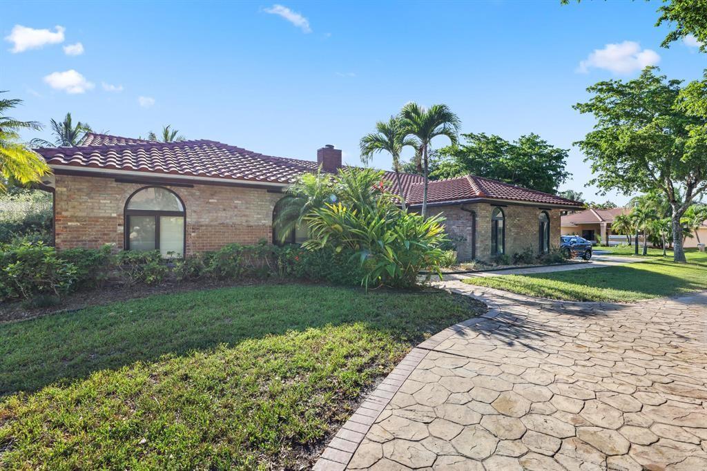 5172 Northwest 84th Road Coral Springs, FL 33067 - Photo 24 of 24 a view of a house with a yard
