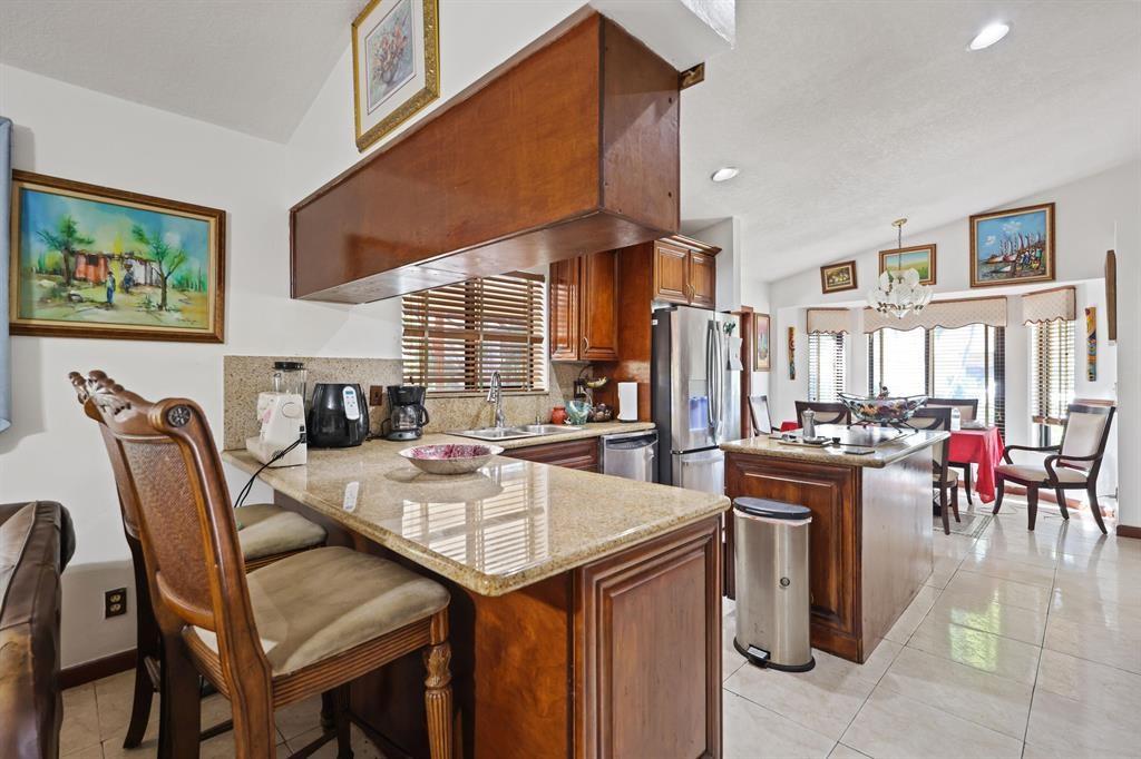 5172 Northwest 84th Road Coral Springs, FL 33067 - Photo 5 of 24 a view of a dining room with furniture
