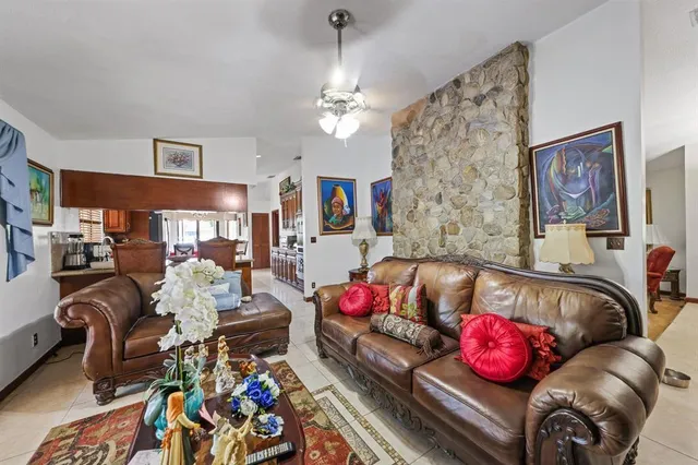 a living room with furniture chess board and a couch