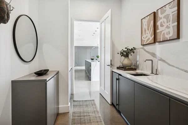 a kitchen with a refrigerator and a sink