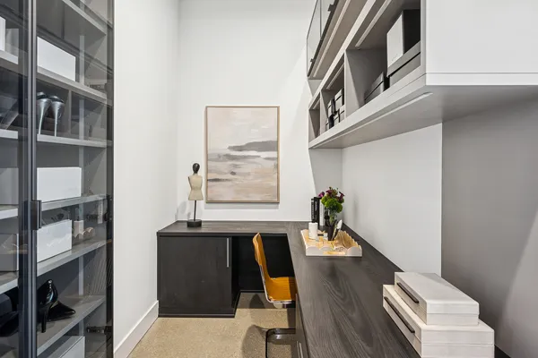 walk in closet with wooden floor