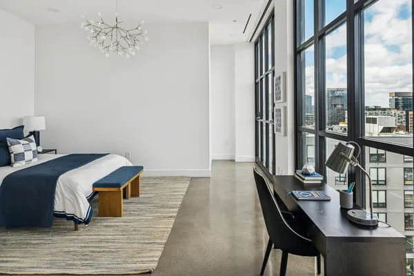 a room with a bed and a window
