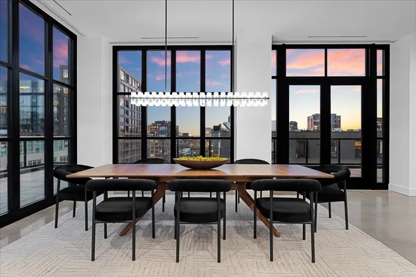 a view of a dining room with furniture window and wooden floor