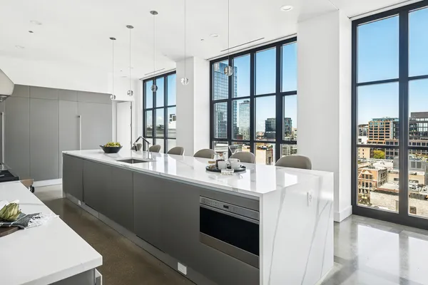 a room with sink cabinets and couch