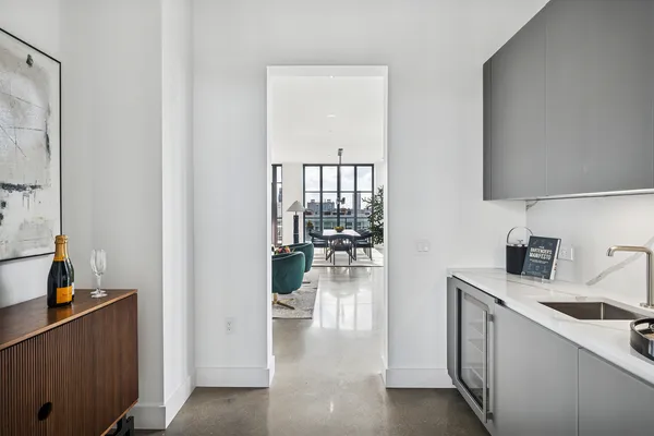 a kitchen with a refrigerator and a sink