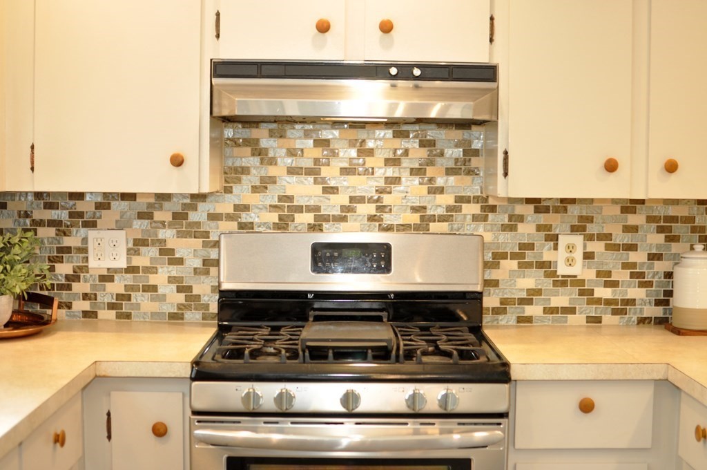 30 Chester Road Boxborough, MA 01719 - Photo 20 of 38 a close view of a stove top oven sitting inside of a kitchen