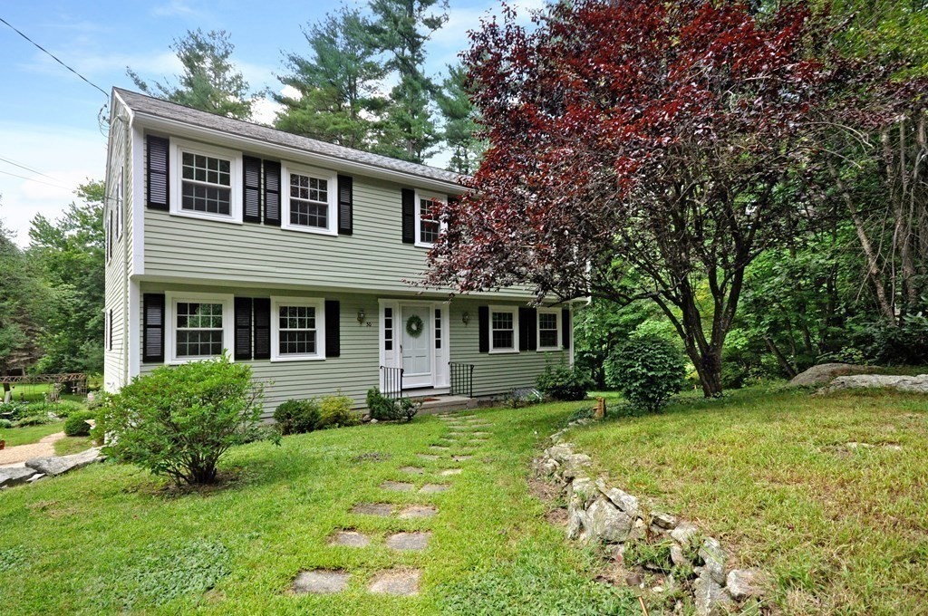 30 Chester Road Boxborough, MA 01719 - Photo 3 of 38 a front view of a house with a yard and trees
