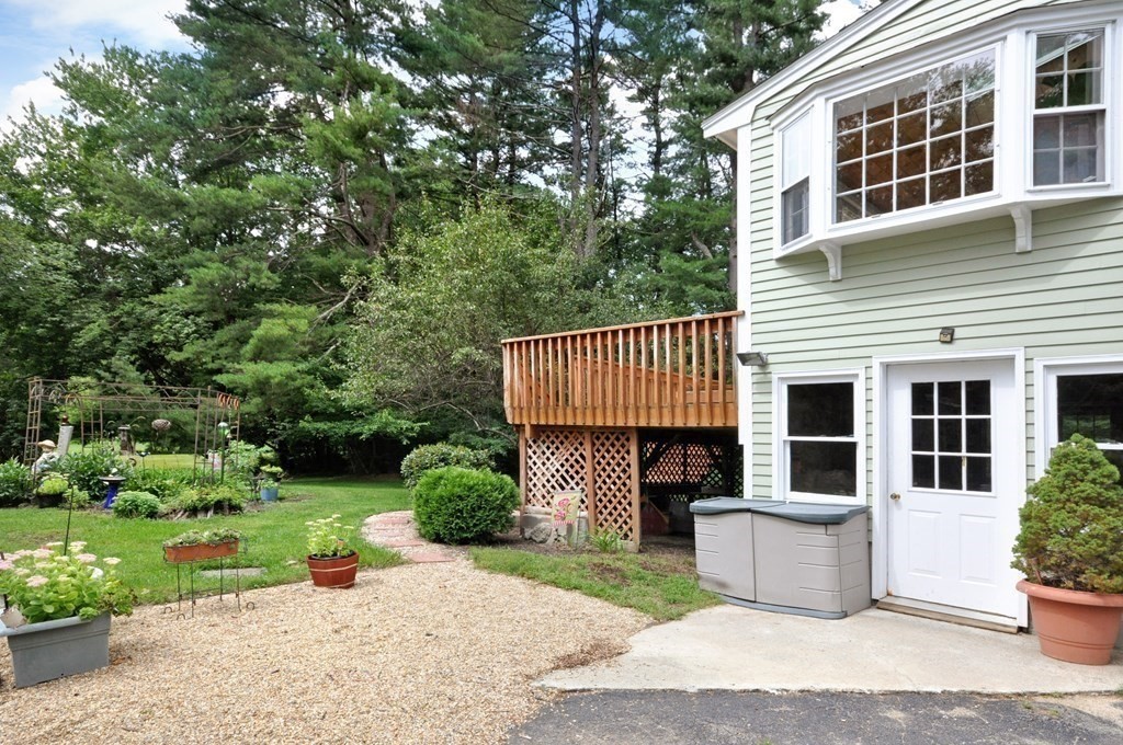 30 Chester Road Boxborough, MA 01719 - Photo 6 of 38 a front view of a house with a garden