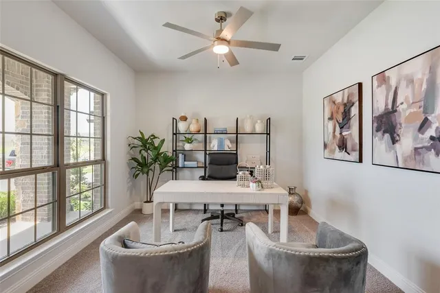 a living room with furniture and window