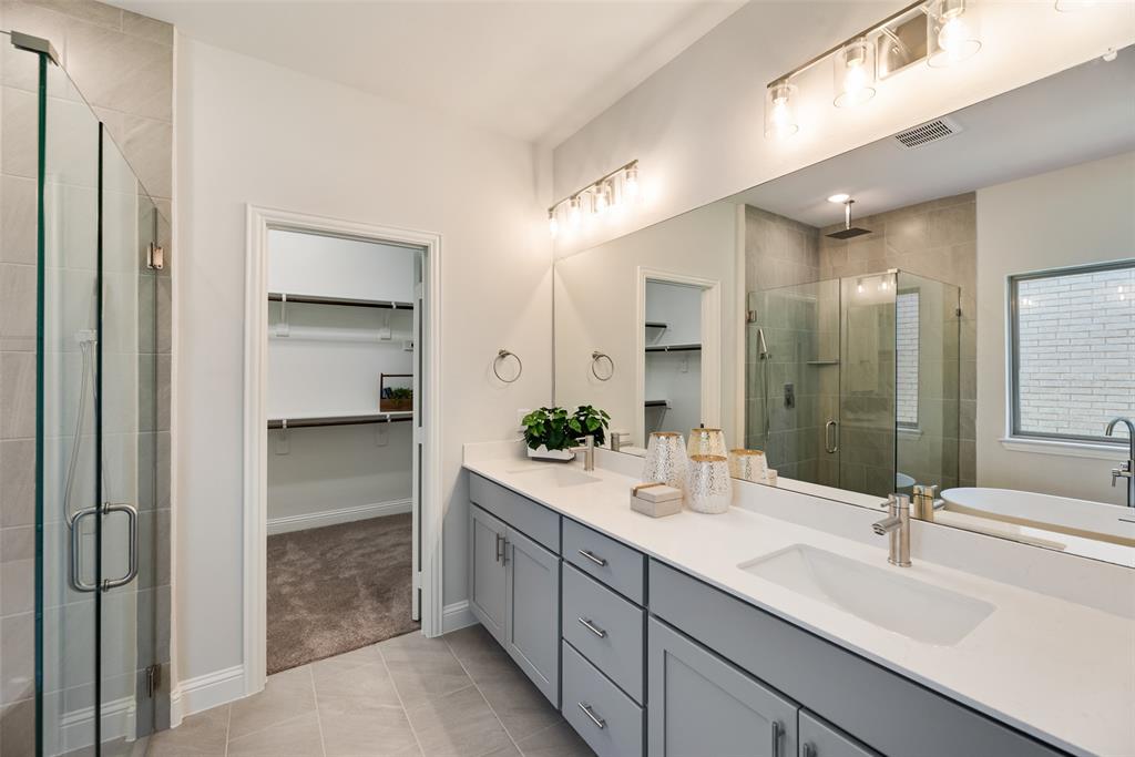 5216 Picasso Road Royse City, TX 75189 - Photo 13 of 25 a spacious bathroom with a double vanity sink mirror and shower