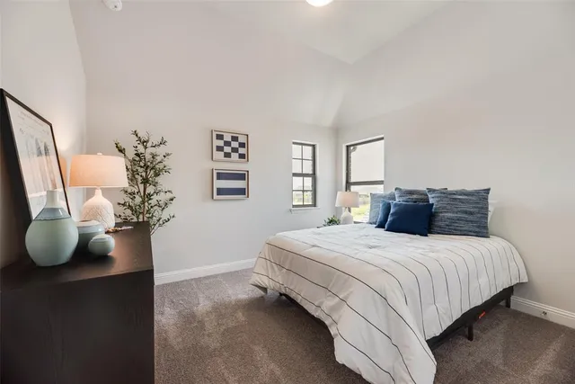 a bedroom with a bed and a potted plant