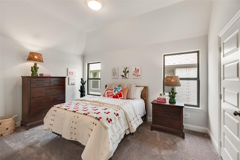 5216 Picasso Road Royse City, TX 75189 - Photo 17 of 25 a bedroom with a bed and dresser