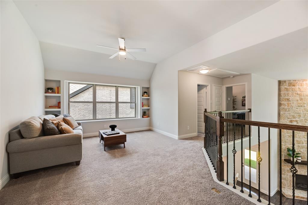 5216 Picasso Road Royse City, TX 75189 - Photo 22 of 25 a living room with furniture and a large window