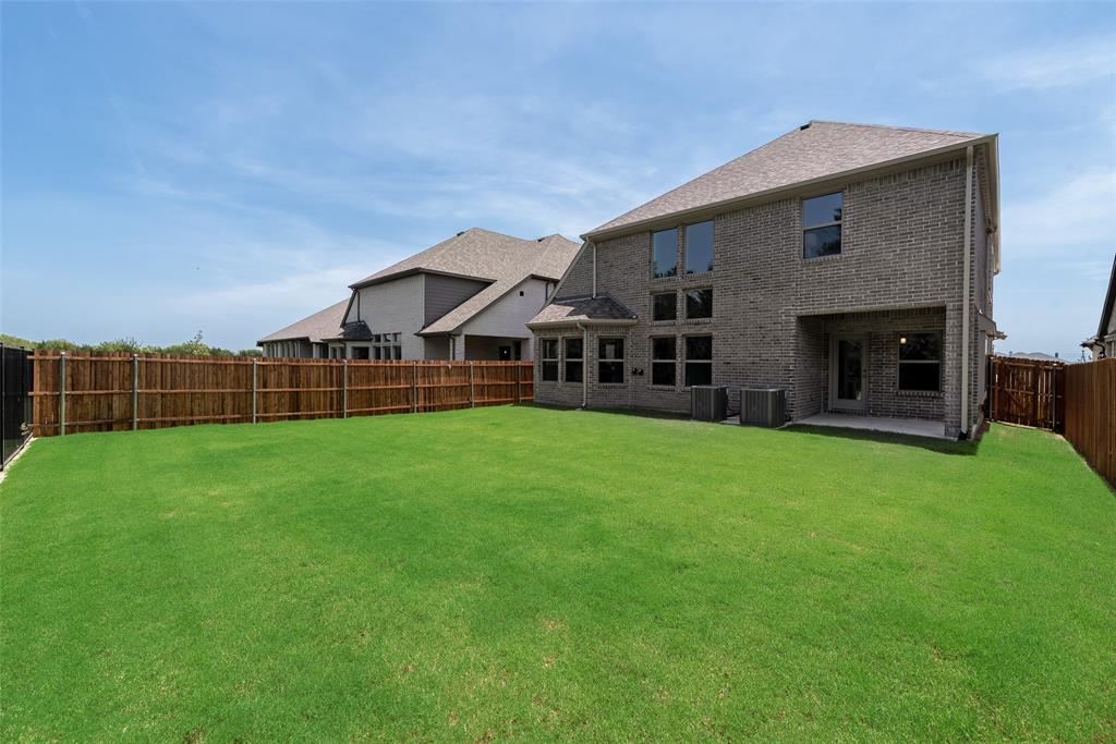 5216 Picasso Road Royse City, TX 75189 - Photo 25 of 25 a view of a house with a big yard potted plants and large tree