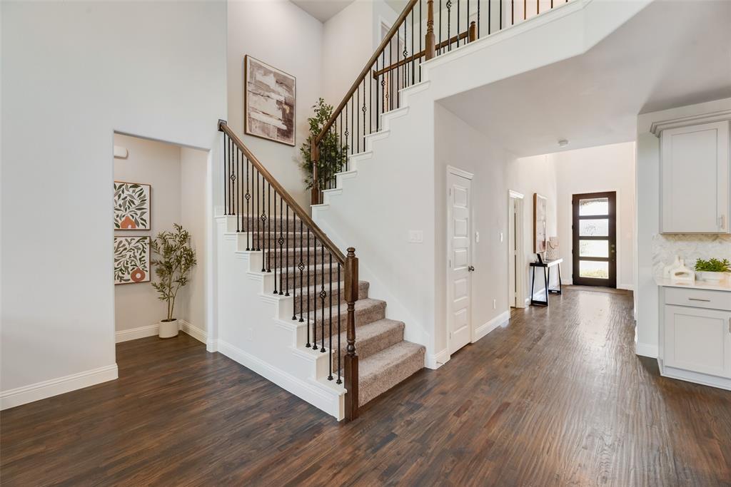 5216 Picasso Road Royse City, TX 75189 - Photo 4 of 25 a view of entryway with wooden floor and stairs