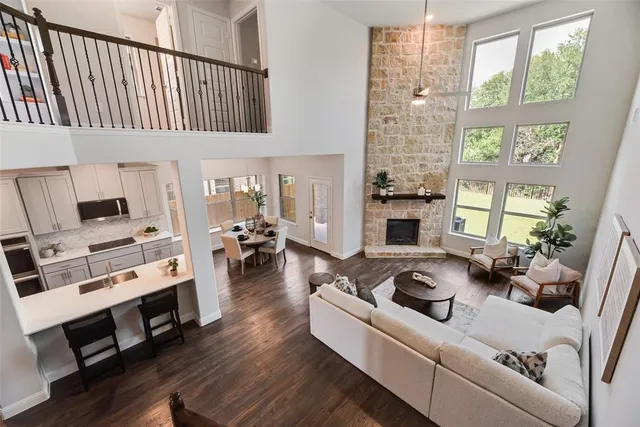 a living room with furniture fireplace and flat screen tv