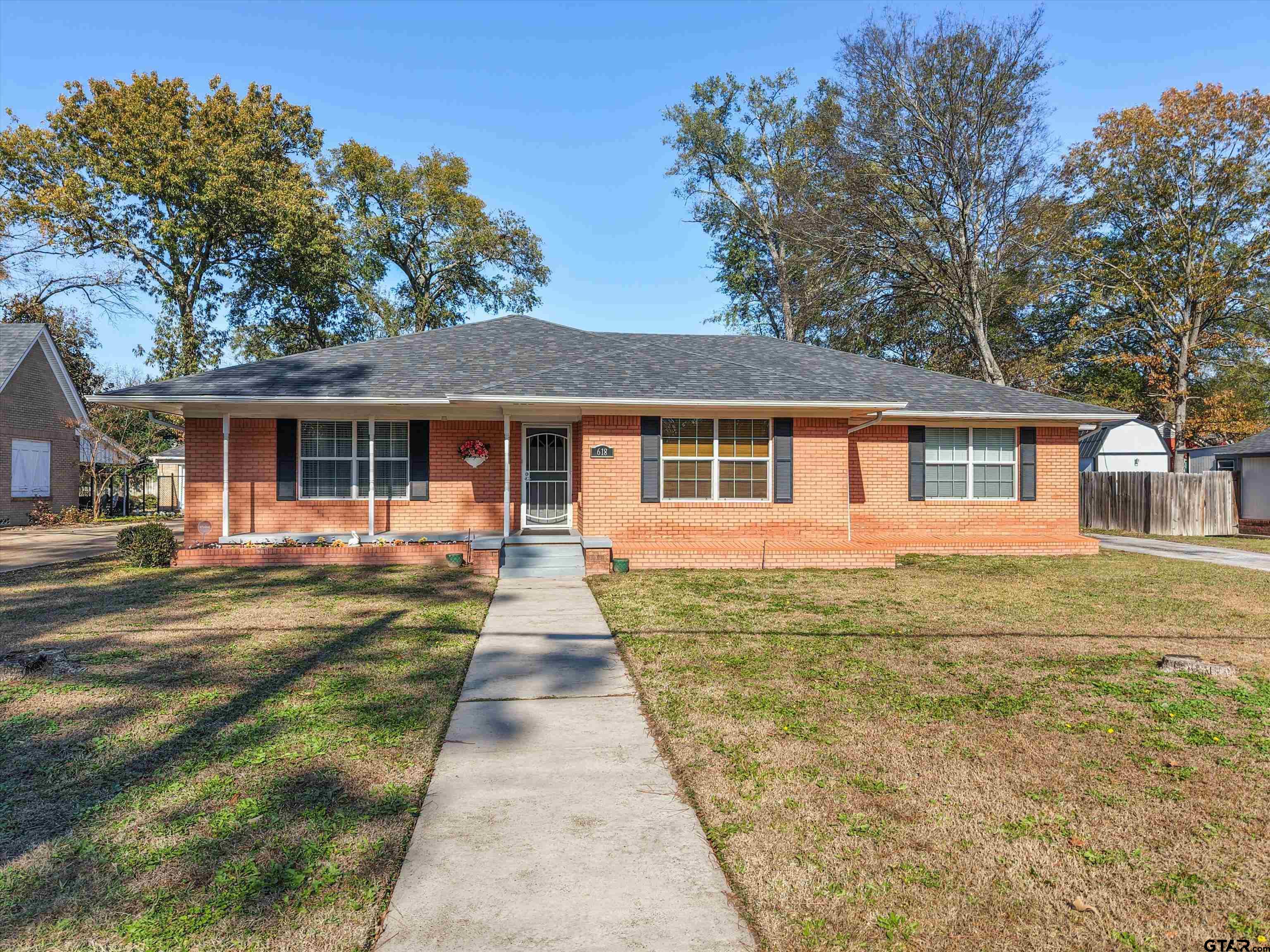 618 Walnut Street Gilmer, TX 75644 - Photo 1 of 30 a front view of a house with a yard
