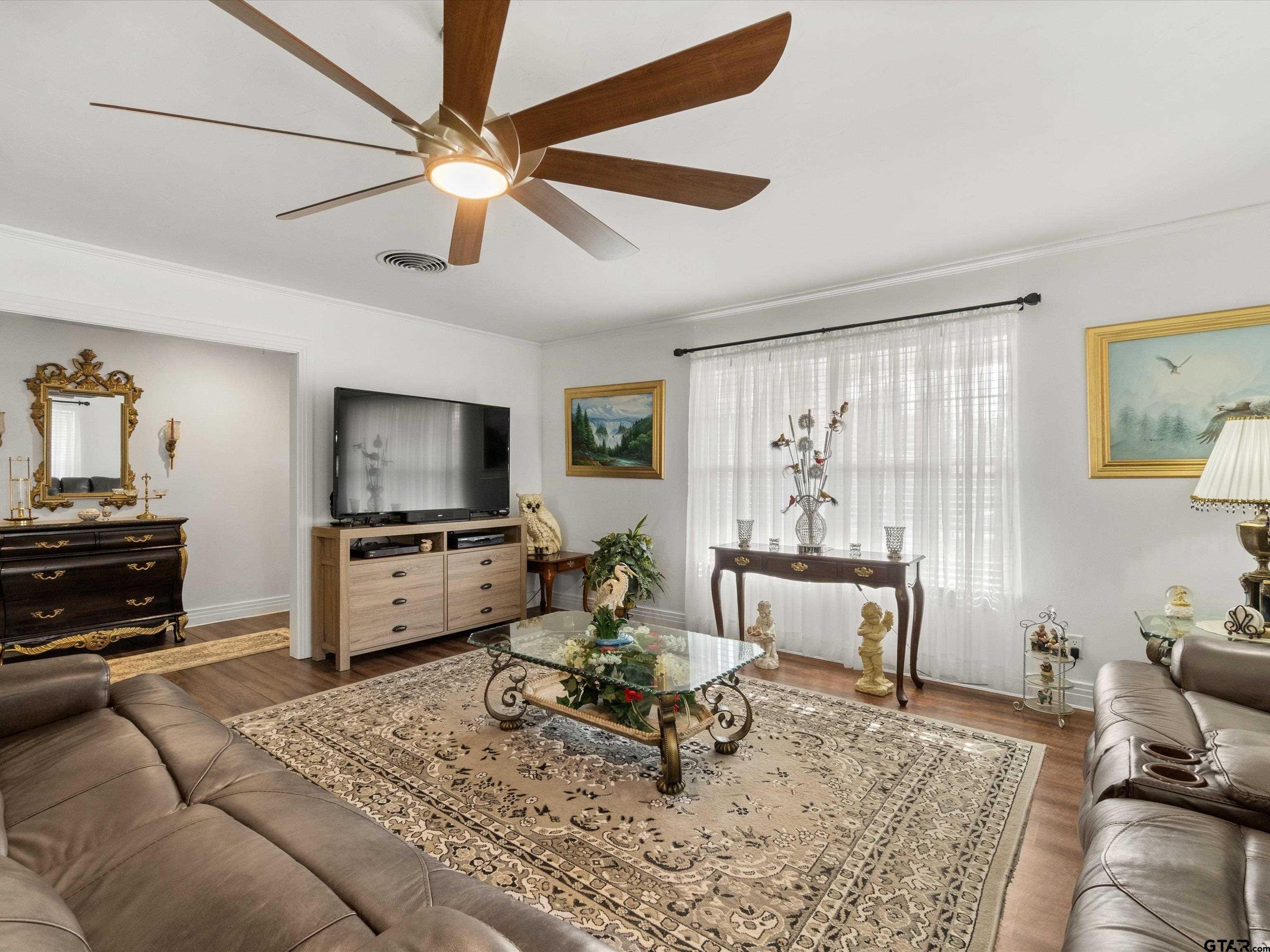 618 Walnut Street Gilmer, TX 75644 - Photo 11 of 30 a living room with furniture and a flat screen tv