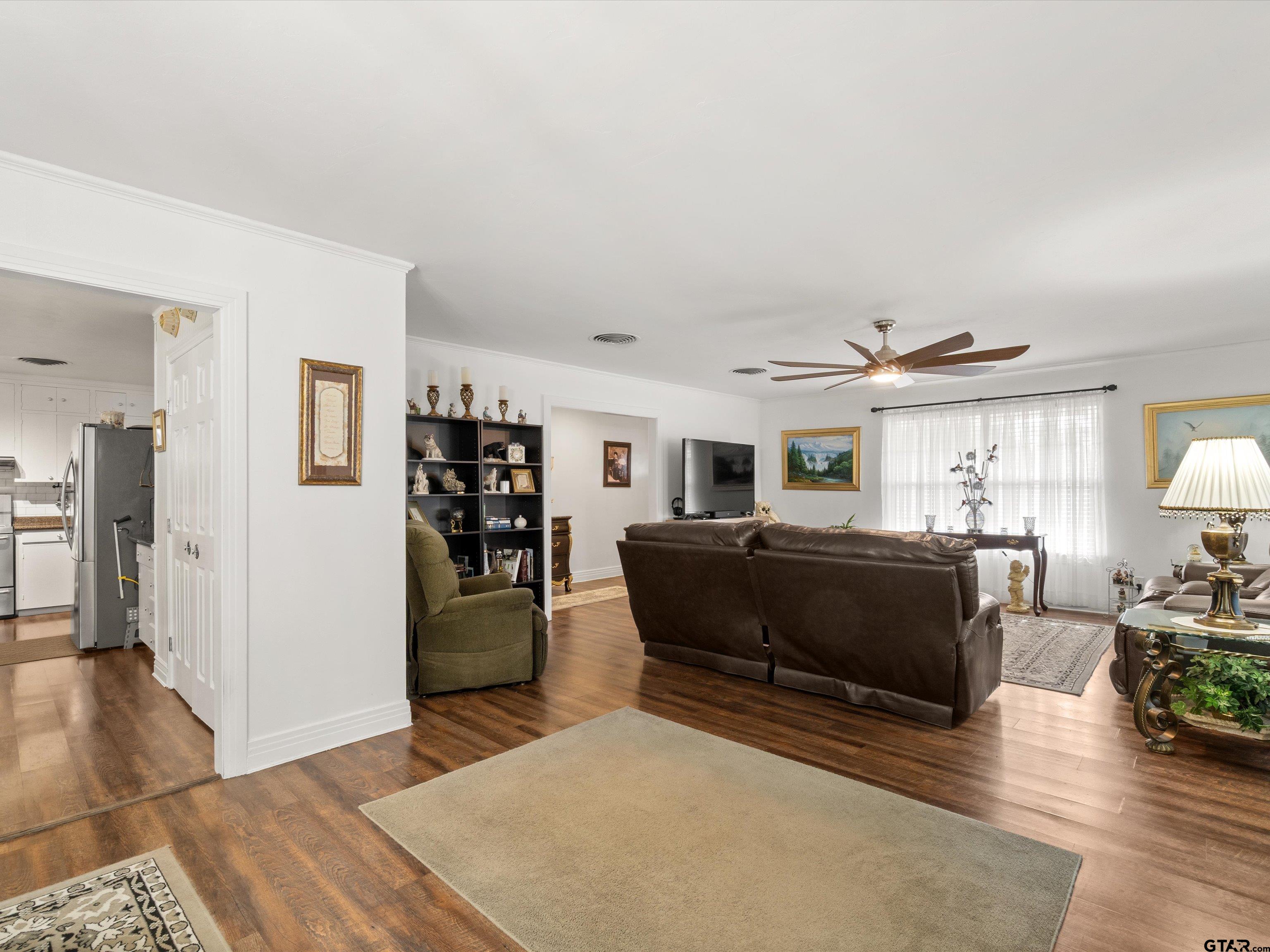 618 Walnut Street Gilmer, TX 75644 - Photo 13 of 30 a living room with furniture and a wooden floor