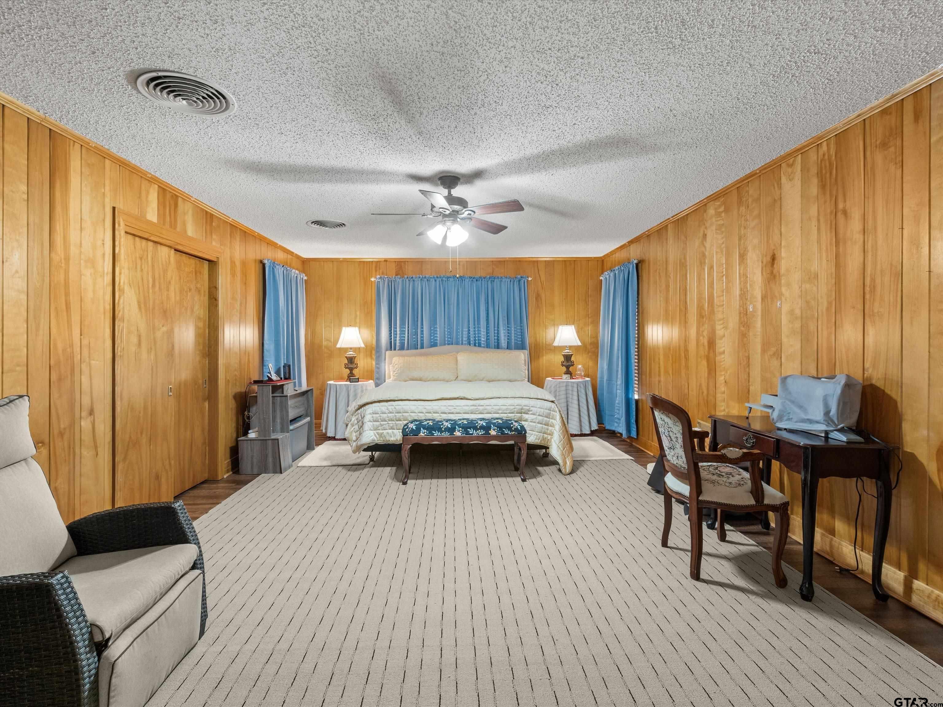 618 Walnut Street Gilmer, TX 75644 - Photo 21 of 30 a bedroom with furniture and window