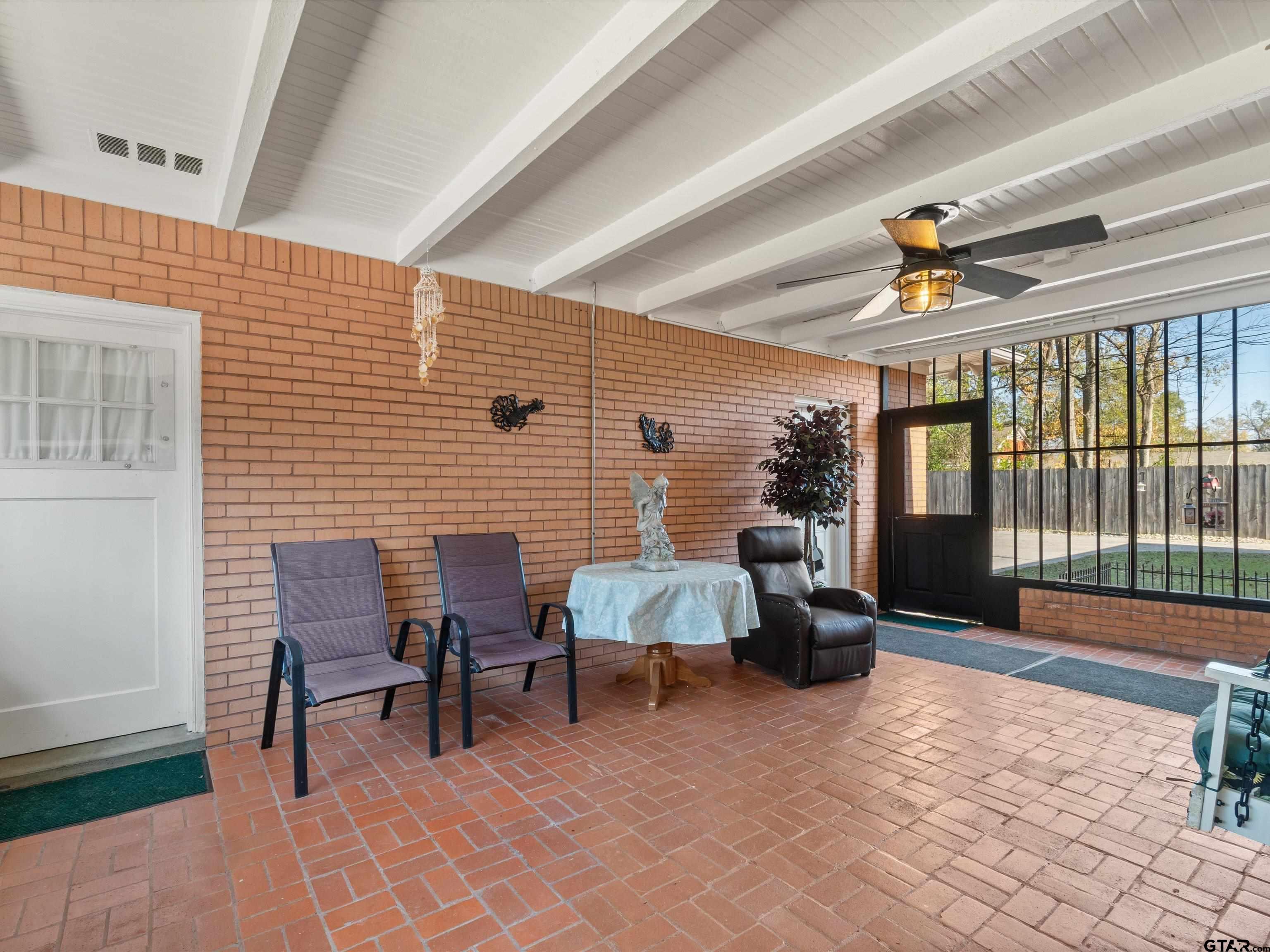 618 Walnut Street Gilmer, TX 75644 - Photo 27 of 30 a view of patio with a table and chairs and a barbeque