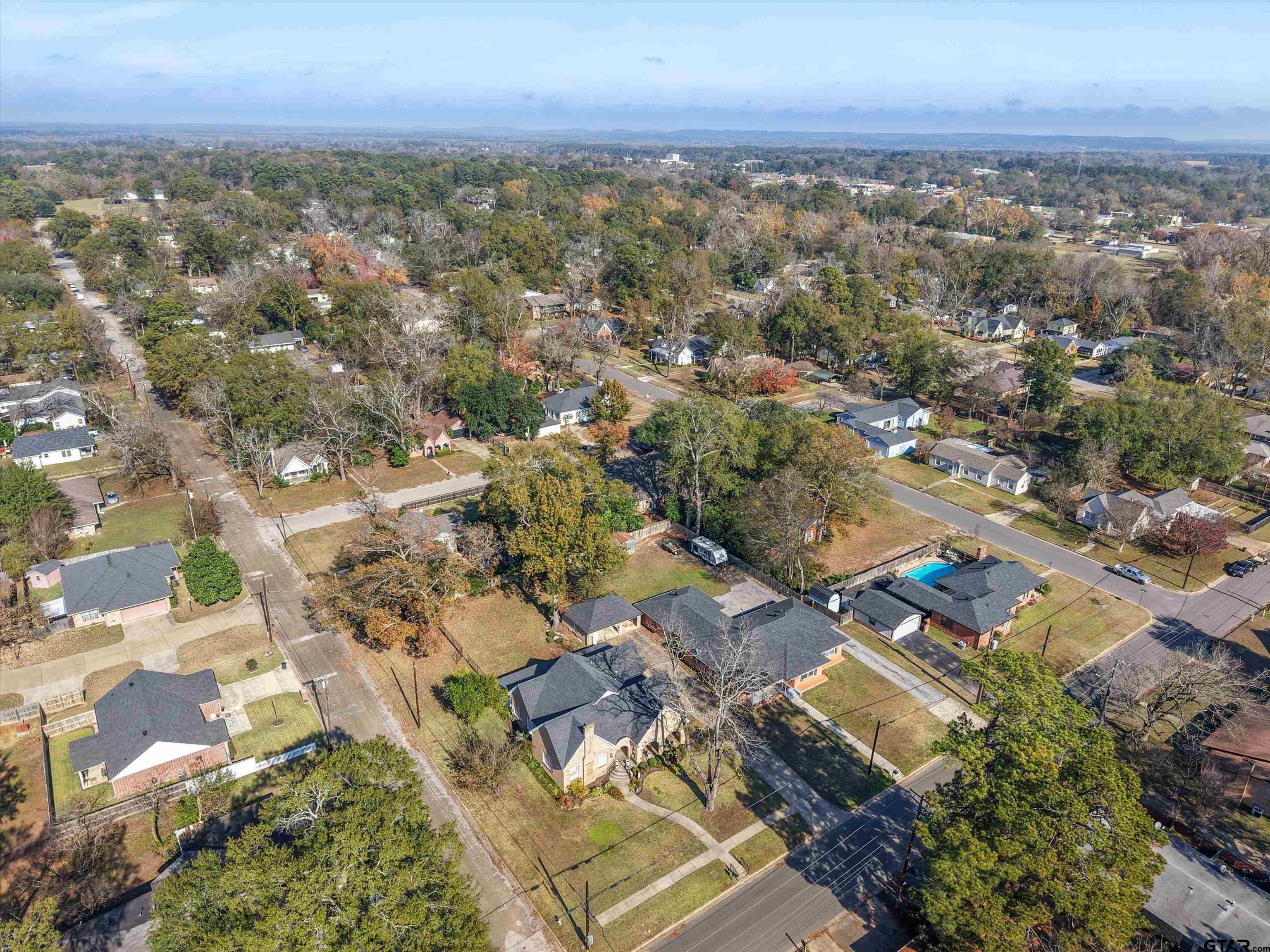 618 Walnut Street Gilmer, TX 75644 - Photo 4 of 30 an aerial view of residential building with green space
