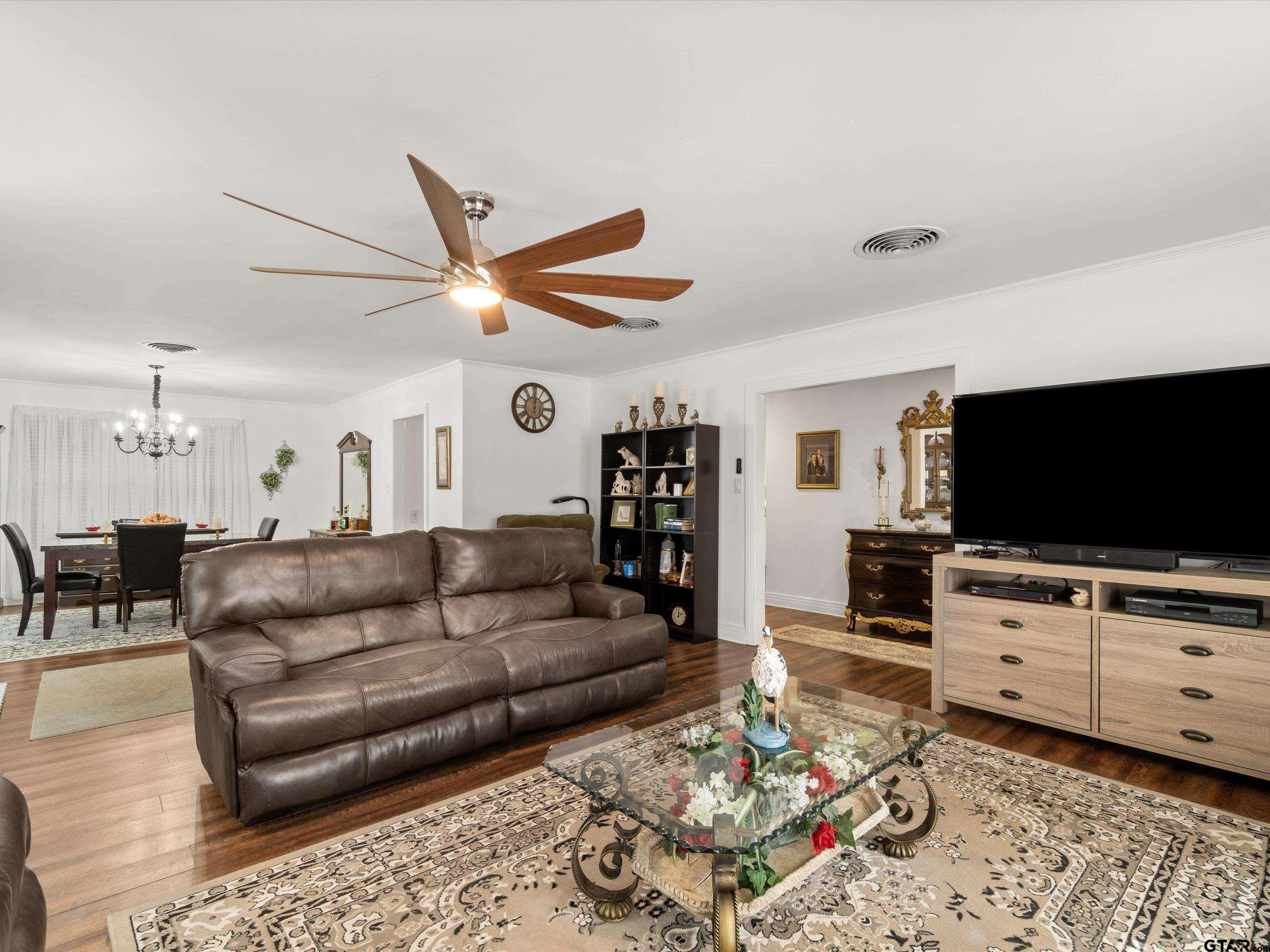 618 Walnut Street Gilmer, TX 75644 - Photo 10 of 30 a living room with furniture and a flat screen tv