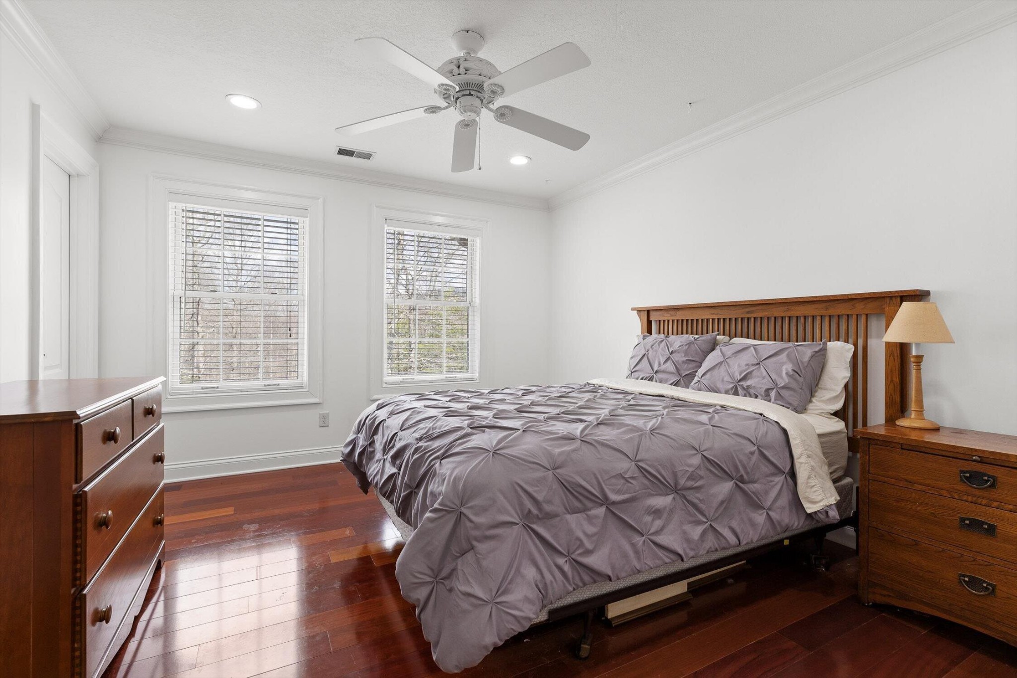 1250 Owl Hollow Road McDonald, TN 37353 - Photo 48 of 87 a bedroom with a large bed and a chandelier