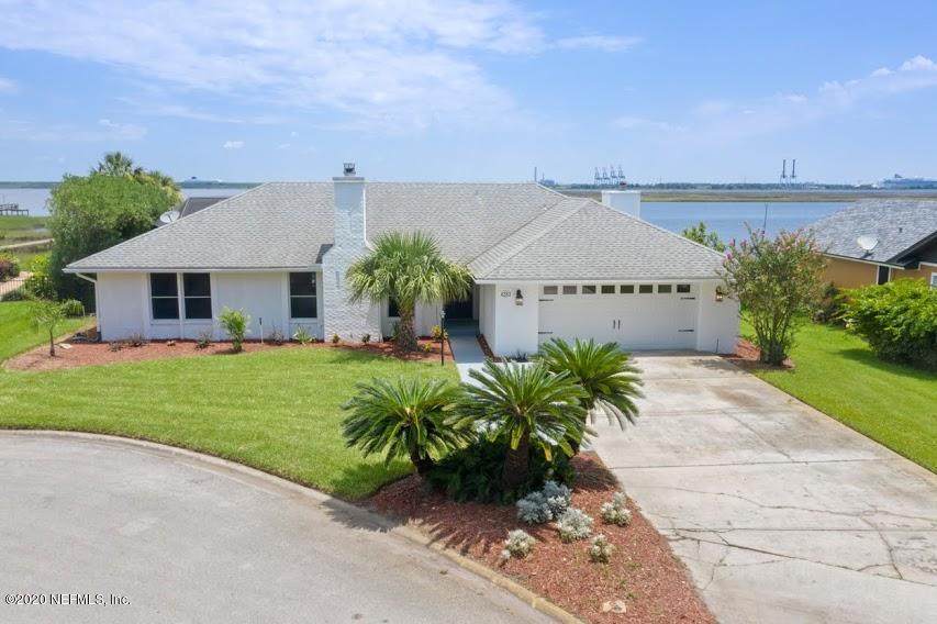 4283 Heath Road Jacksonville, FL 32277 - Photo 1 of 30 a front view of a house with a garden and plants