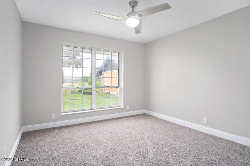 4283 Heath Road Jacksonville, FL 32277 - Photo 17 of 30 an empty room with a window and a fan