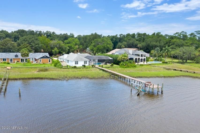 4283 Heath Road Jacksonville, FL 32277 - Photo 30 of 30 an aerial view of a house with outdoor space swimming pool and lake view