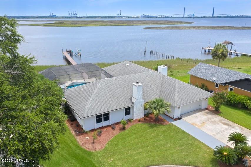 4283 Heath Road Jacksonville, FL 32277 - Photo 3 of 30 an aerial view of a house with a garden and lake view