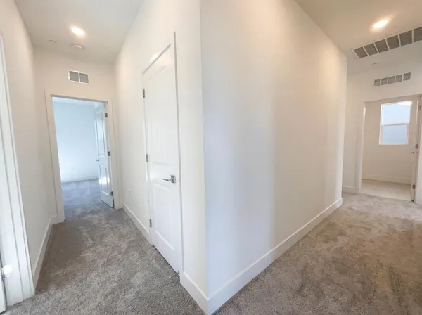 a view of a hallway with an empty room