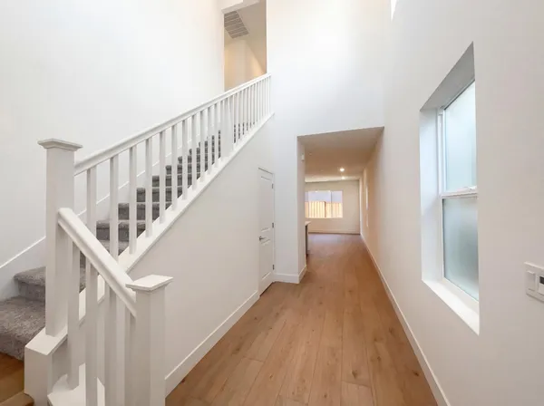 a view of an entryway with wooden floor