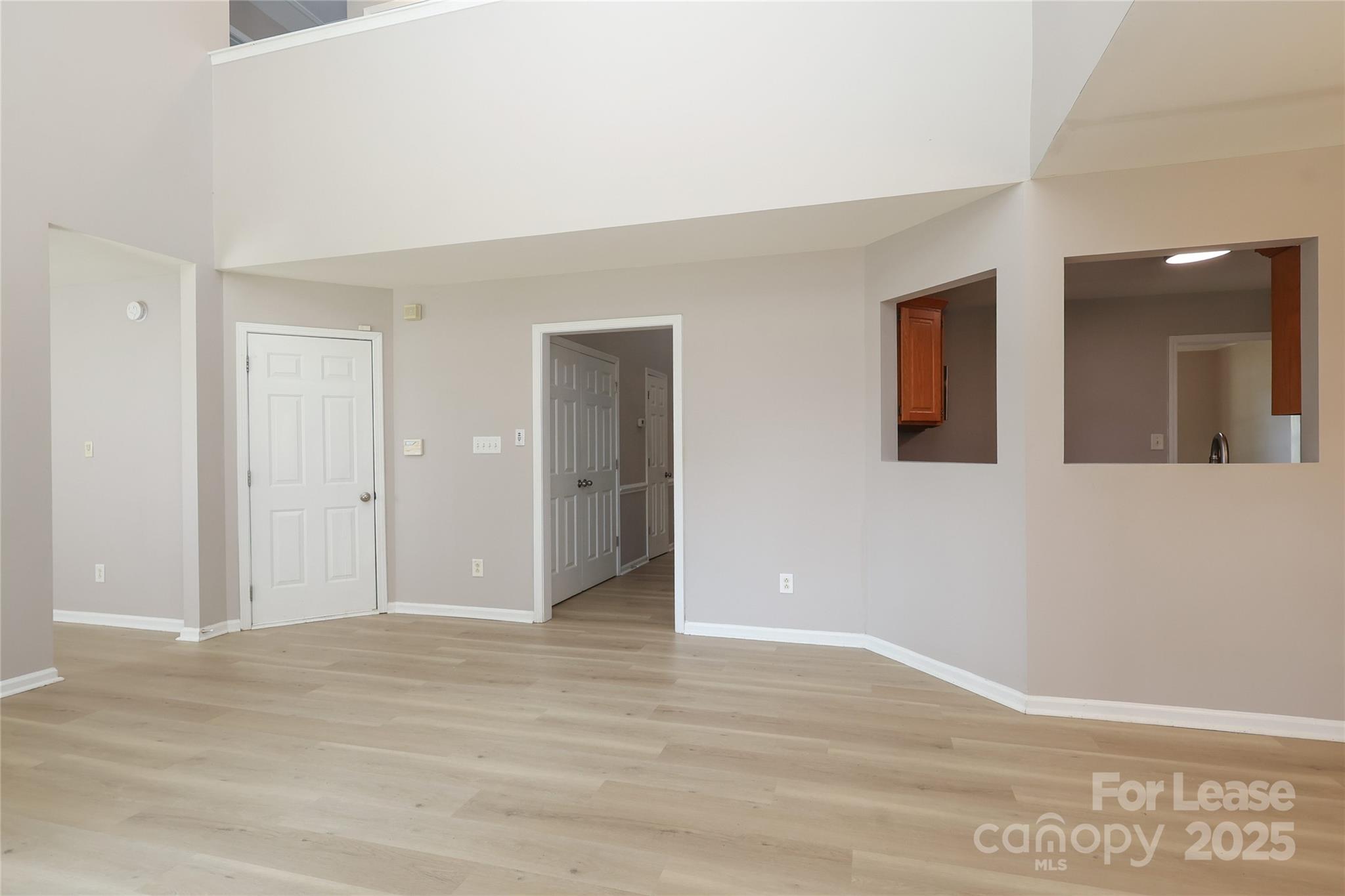 4112 Chatterleigh Drive Monroe, NC 28110 - Photo 13 of 43 a view of an empty room with wooden floor and a window