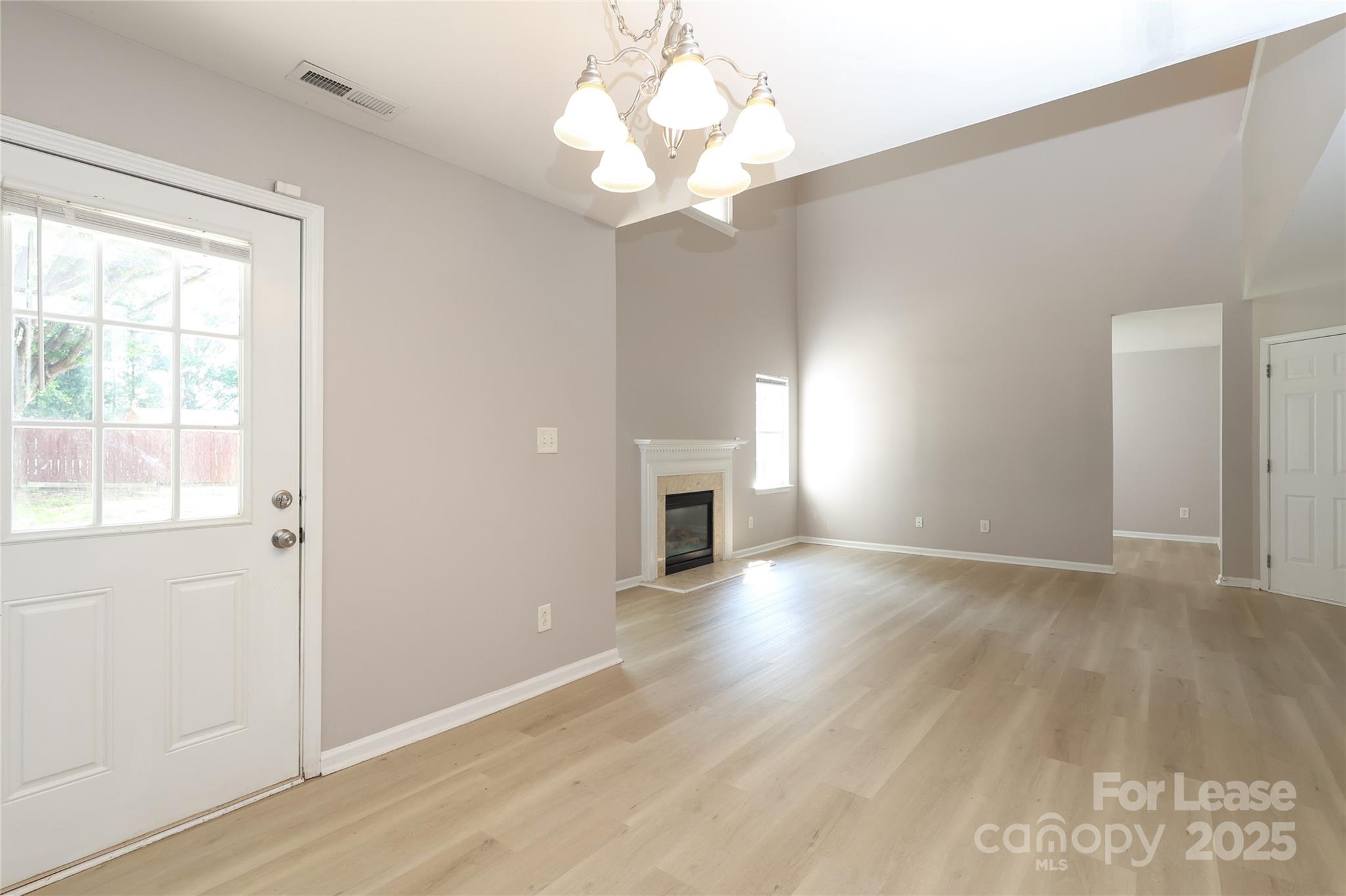 4112 Chatterleigh Drive Monroe, NC 28110 - Photo 14 of 43 wooden floor in an empty room with a window