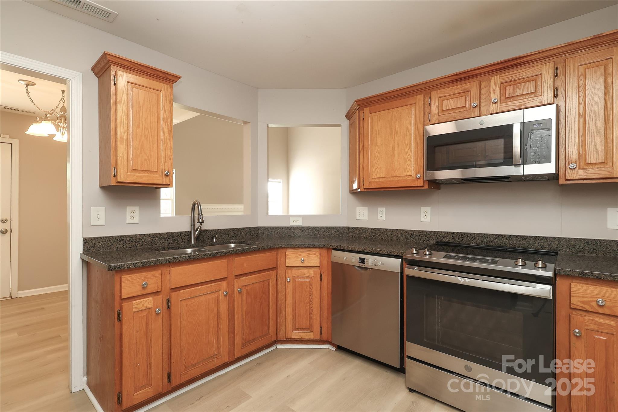 4112 Chatterleigh Drive Monroe, NC 28110 - Photo 15 of 43 a kitchen with granite countertop cabinets stainless steel appliances and a sink