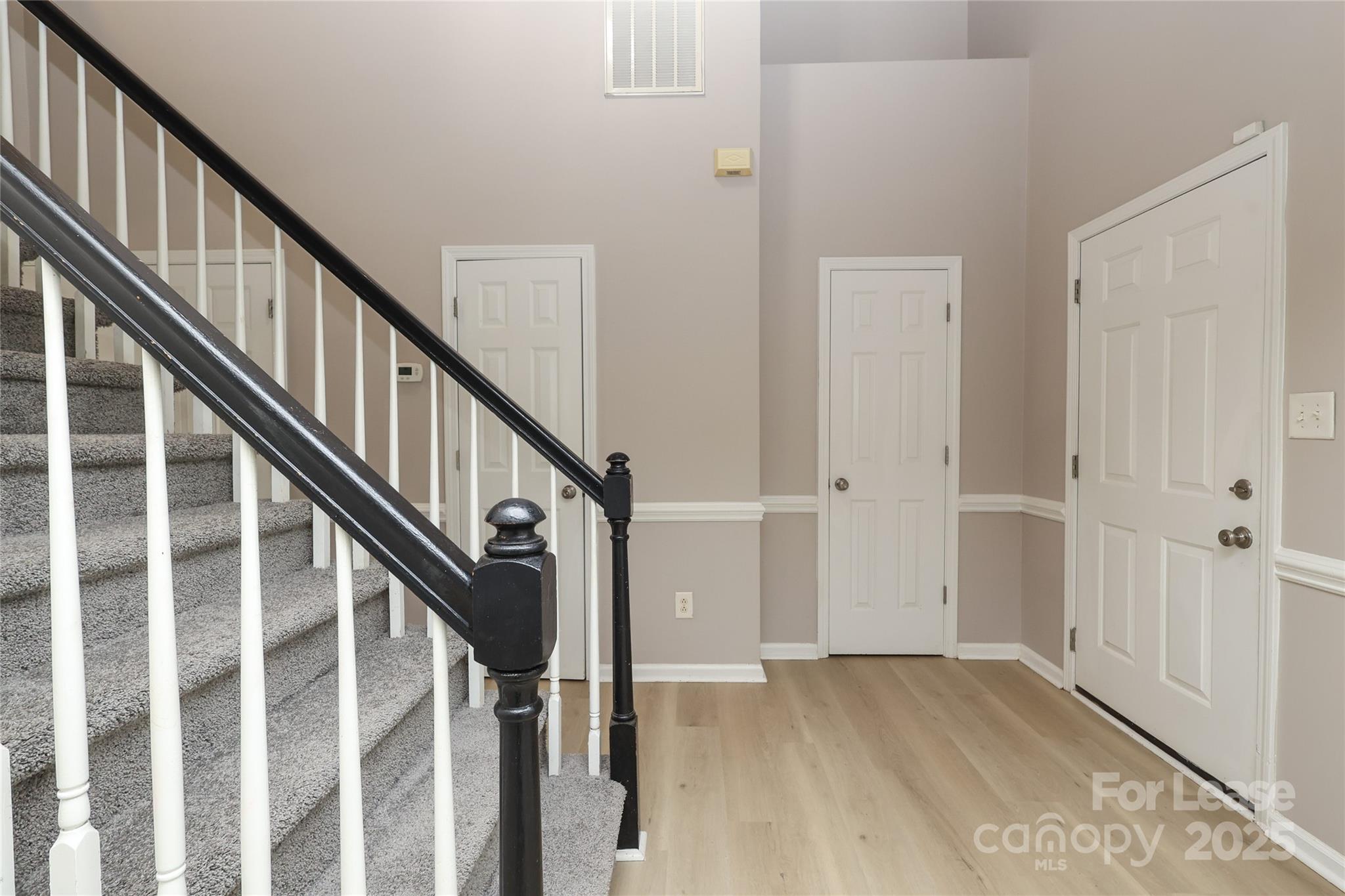 4112 Chatterleigh Drive Monroe, NC 28110 - Photo 18 of 43 a view of staircase with wooden floor and white walls