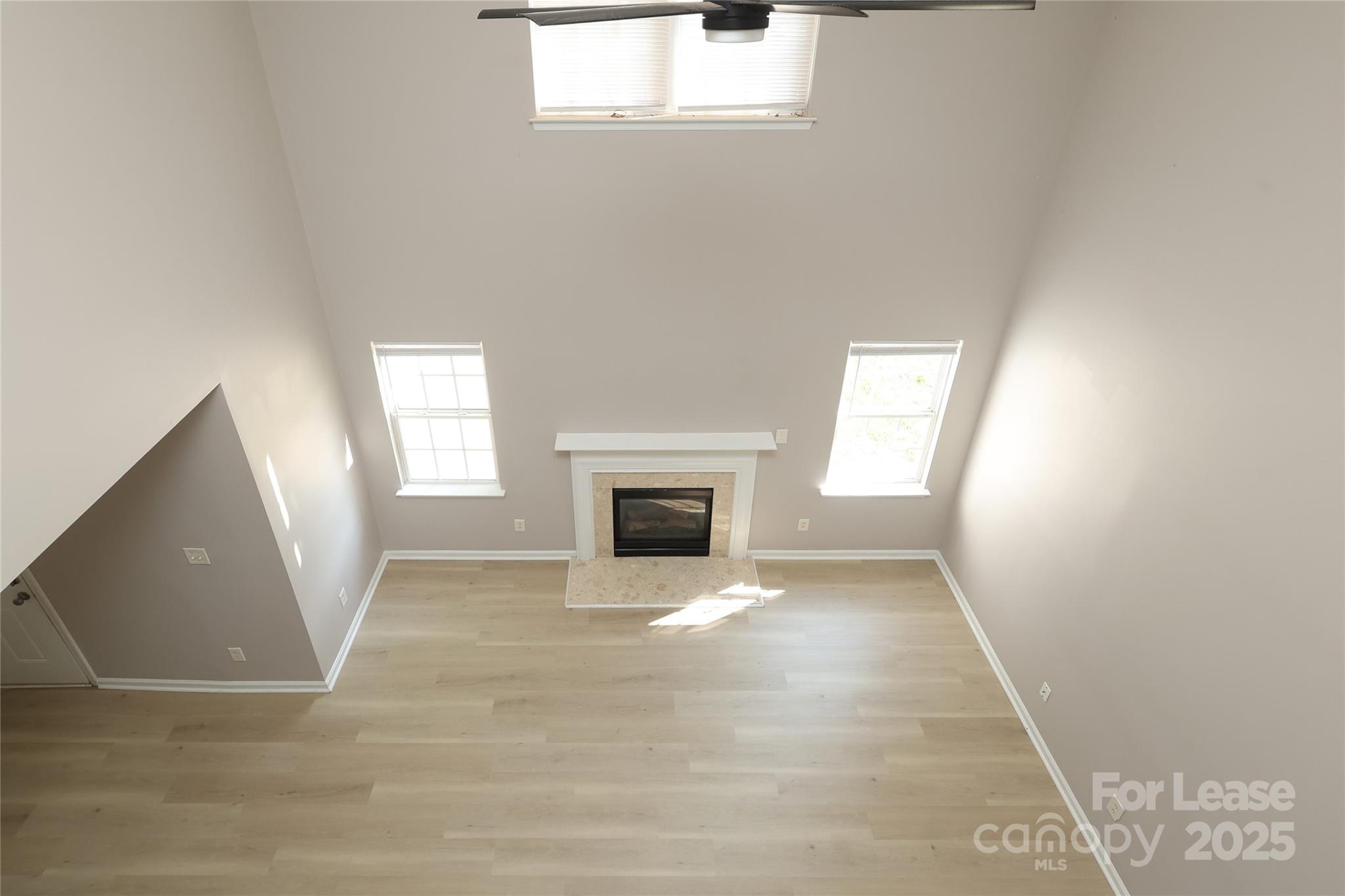 4112 Chatterleigh Drive Monroe, NC 28110 - Photo 20 of 43 a view of an empty room with a window and fireplace