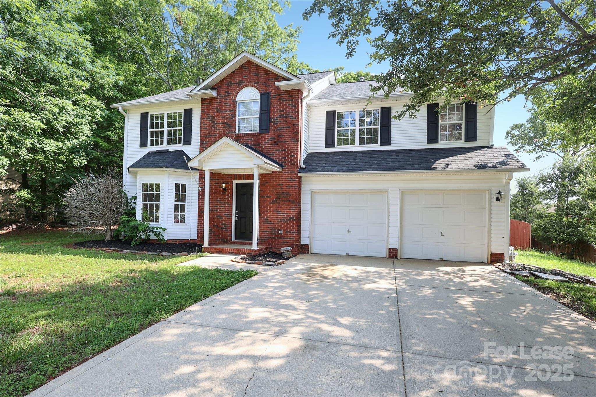 4112 Chatterleigh Drive Monroe, NC 28110 - Photo 2 of 43 a front view of a house with a yard and garage