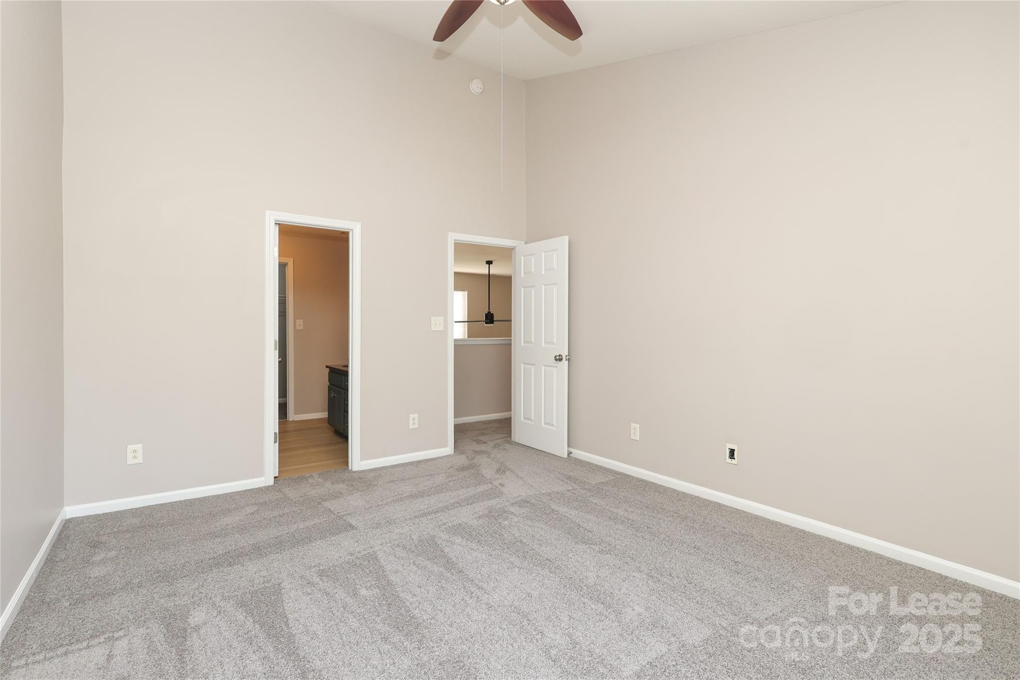 4112 Chatterleigh Drive Monroe, NC 28110 - Photo 24 of 43 an empty room with closet and a chandelier fan