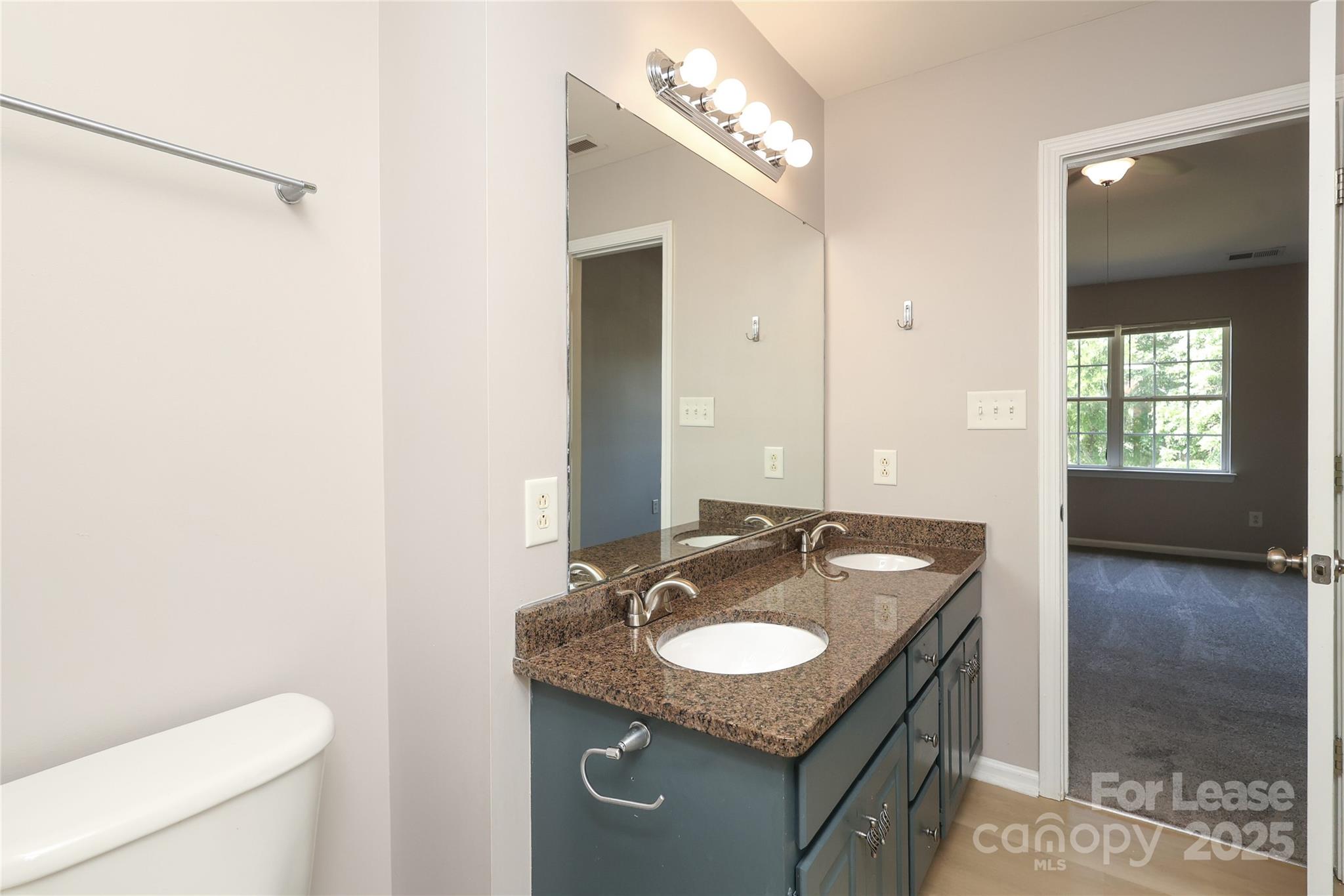 4112 Chatterleigh Drive Monroe, NC 28110 - Photo 27 of 43 a sink and a mirror