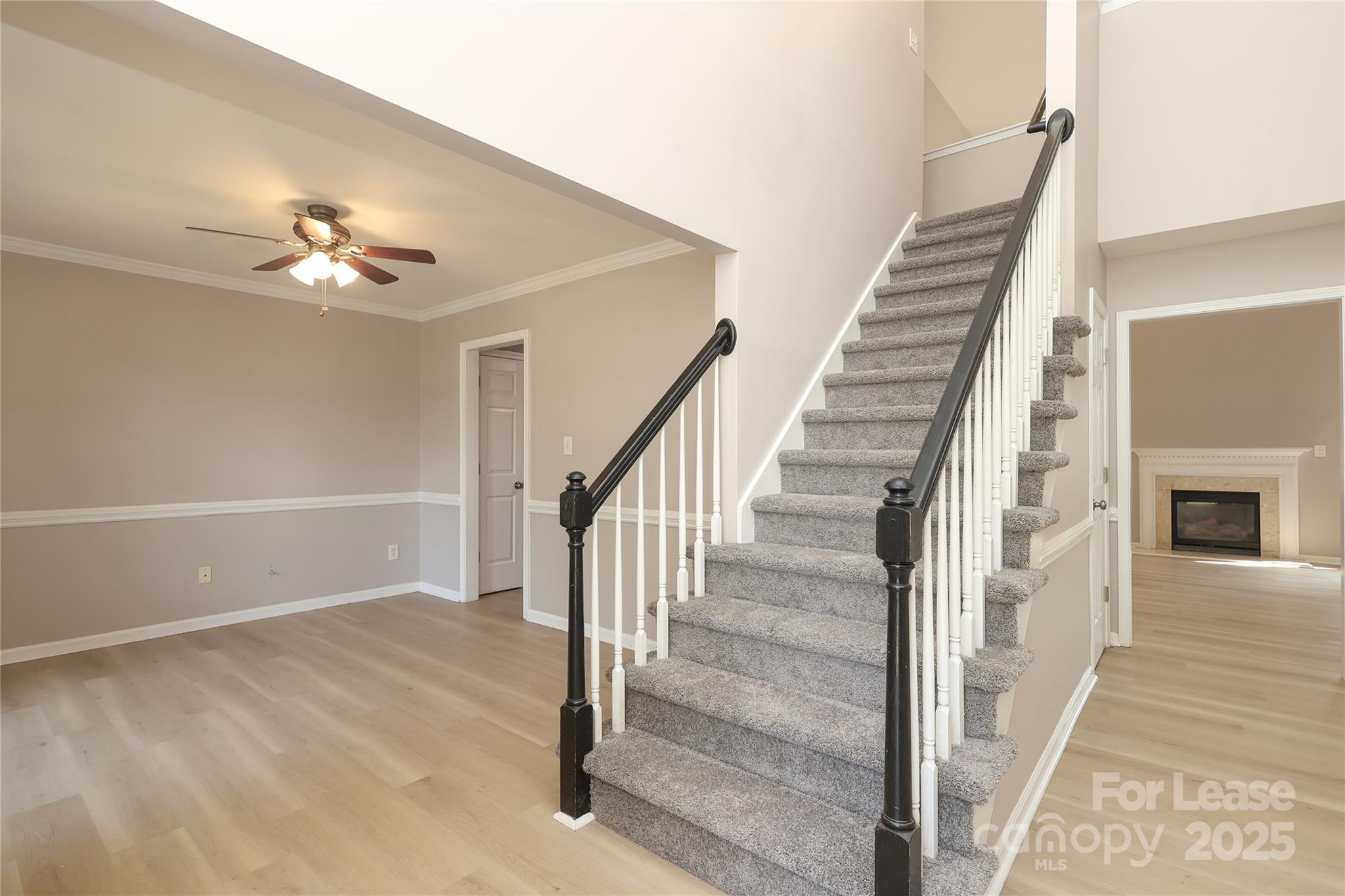 4112 Chatterleigh Drive Monroe, NC 28110 - Photo 3 of 43 a view of staircase with white walls and a ceiling fan