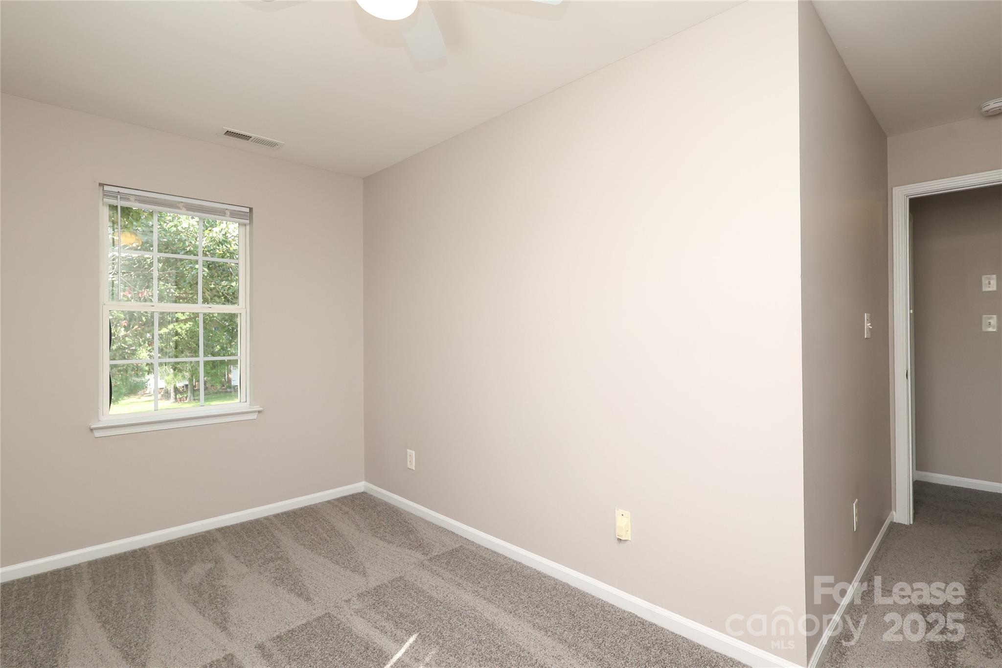 4112 Chatterleigh Drive Monroe, NC 28110 - Photo 32 of 43 an empty room with windows and closet